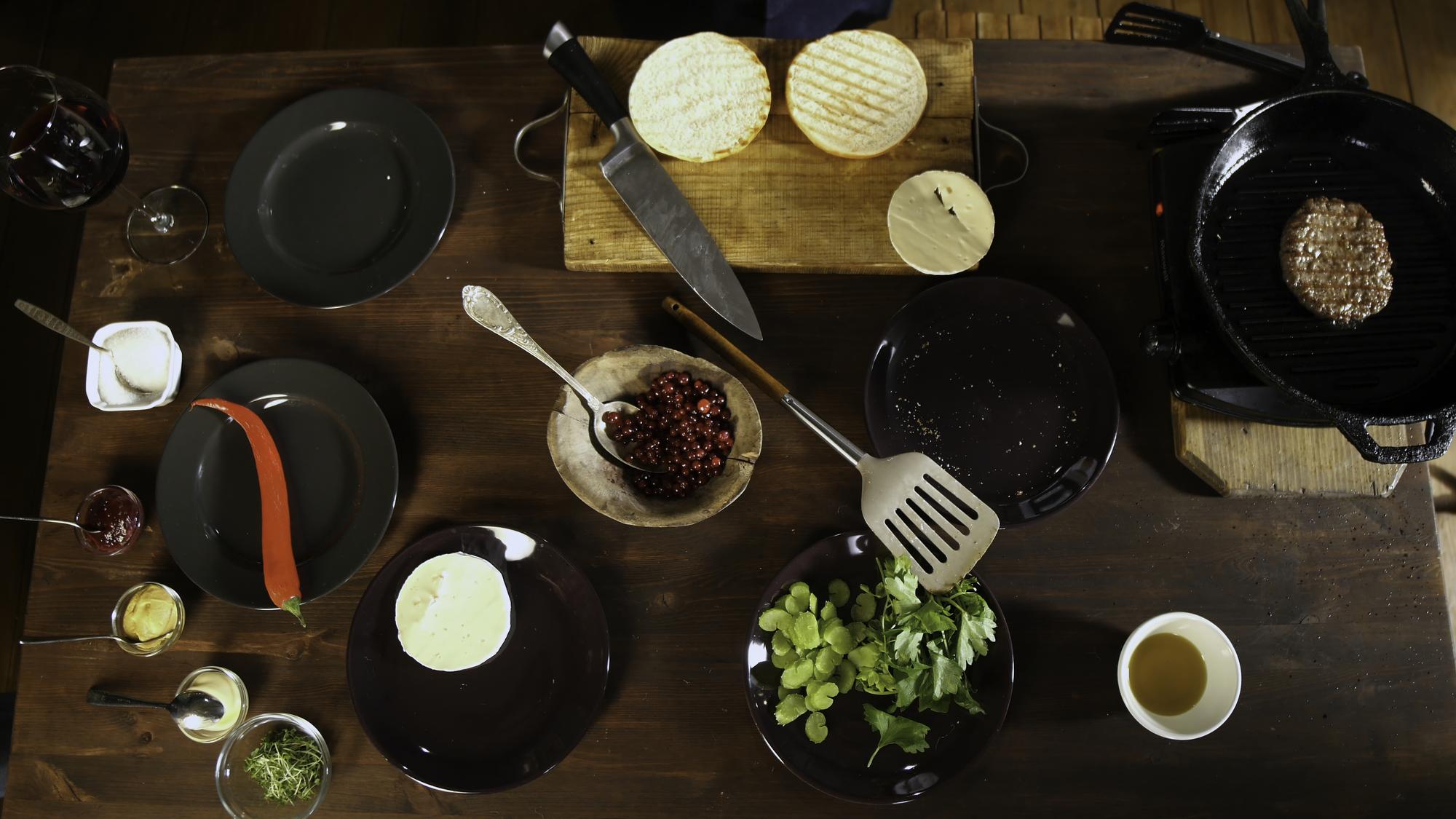 array of plated tasting portions on a dark table